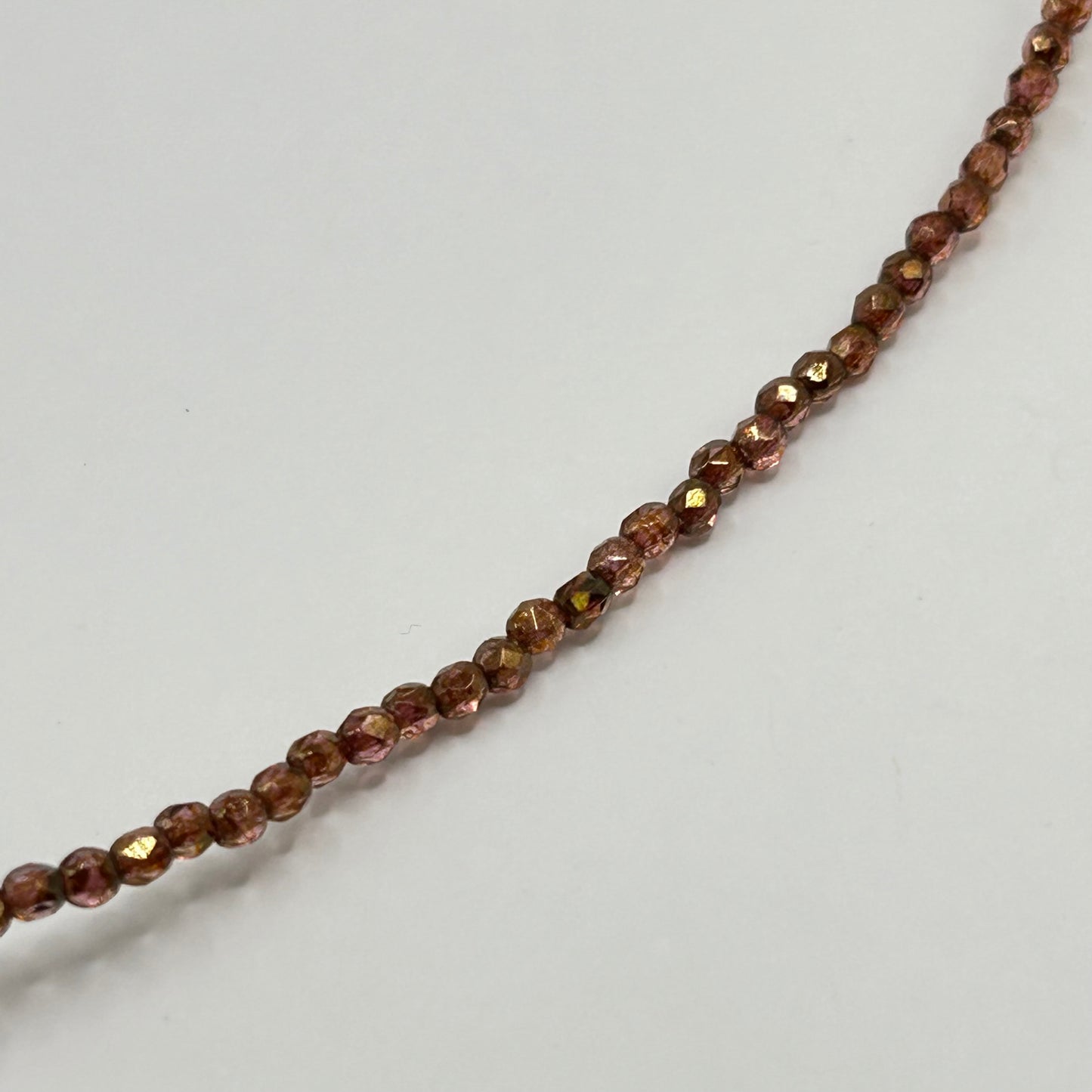 Firepolish 2MM Luster Rose Gold / Topaz - Strand 50