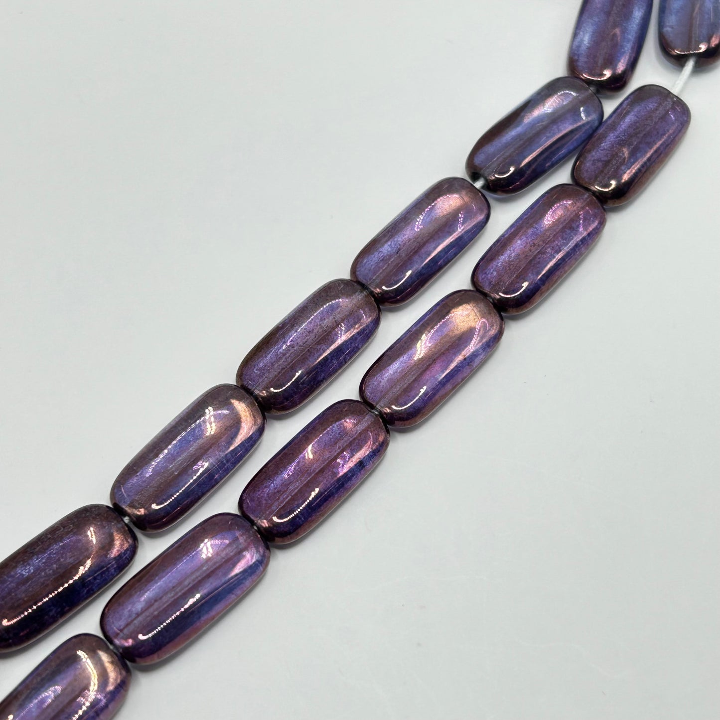 Czech Glass 22x10 MM Flat Twisted Rectangle Luster - Transparent Amethyst - Strand Approx 25