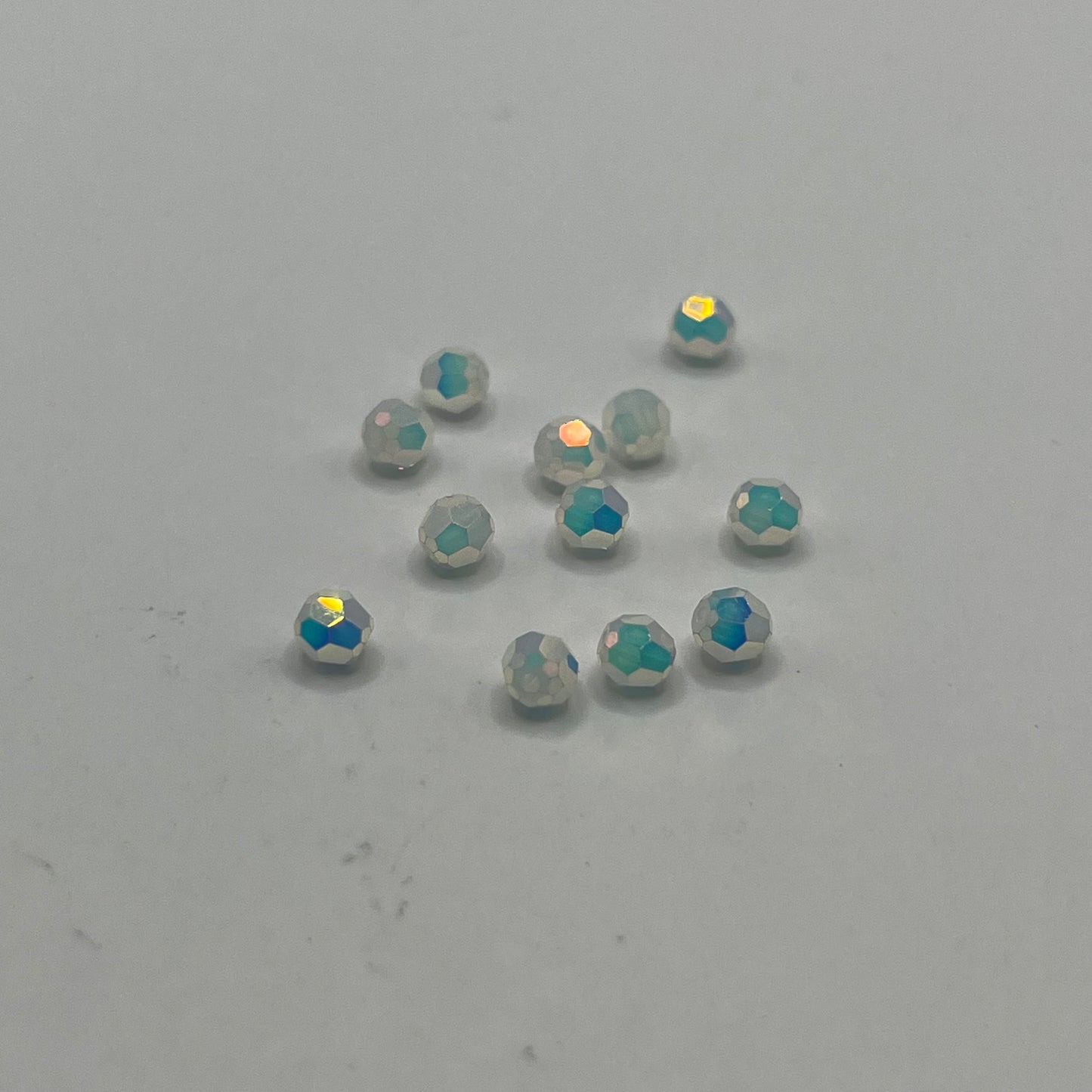 Swarovski 4MM Round Faceted A5000 - White Opal AB Full Coat (12pcs)