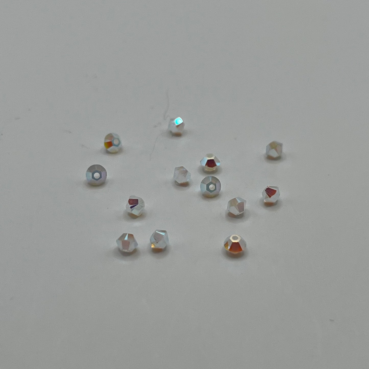Swarovski 3MM Bicones - White Opal AB2X (24pcs)