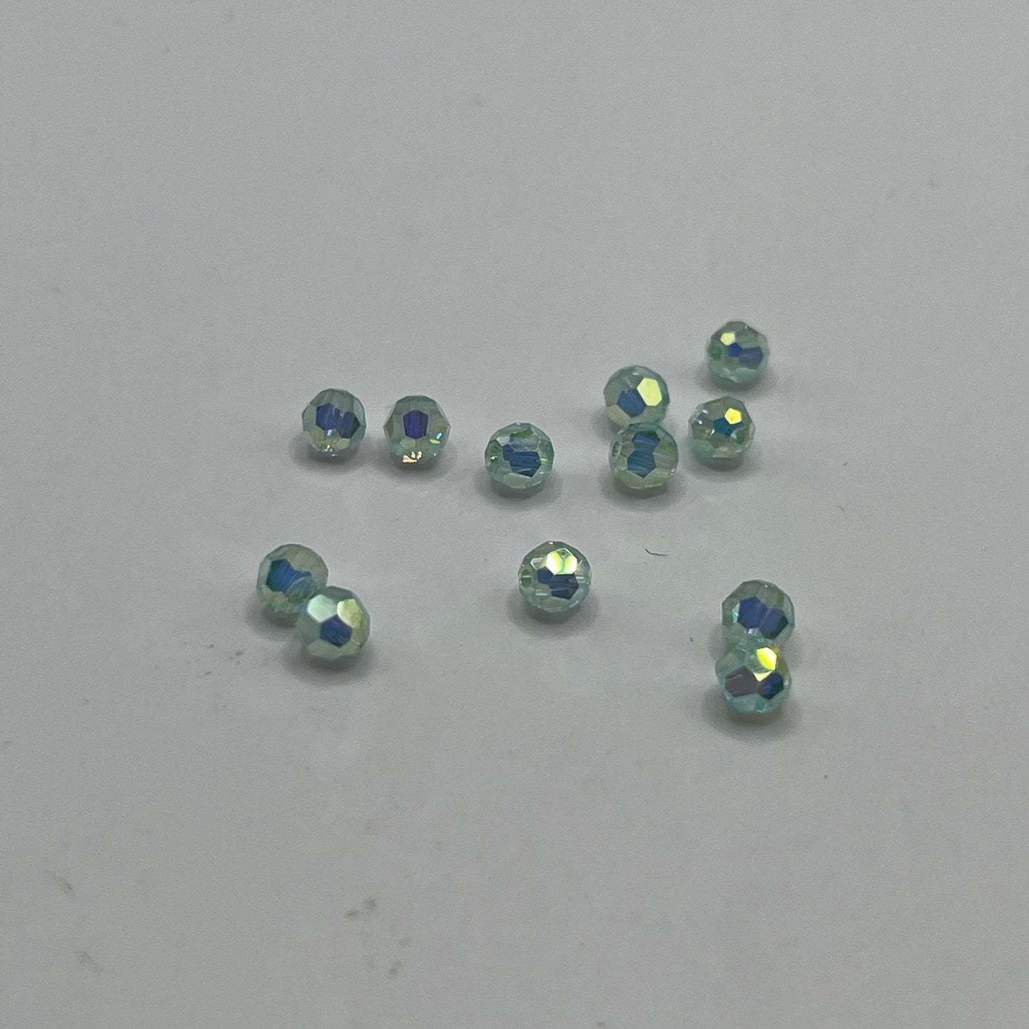 Swarovski 4MM Round Faceted A5000 - Chrysolite AB Full Coat (12pcs)