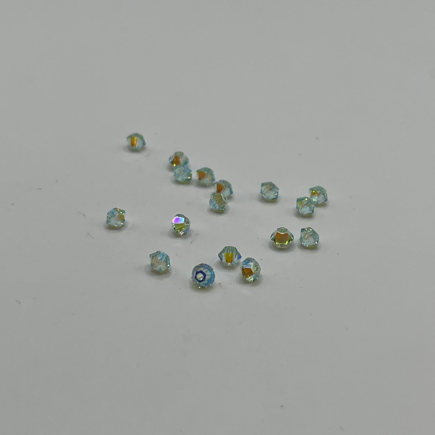 Swarovski 3MM Bicones - Chrysolite AB2X (24pcs)