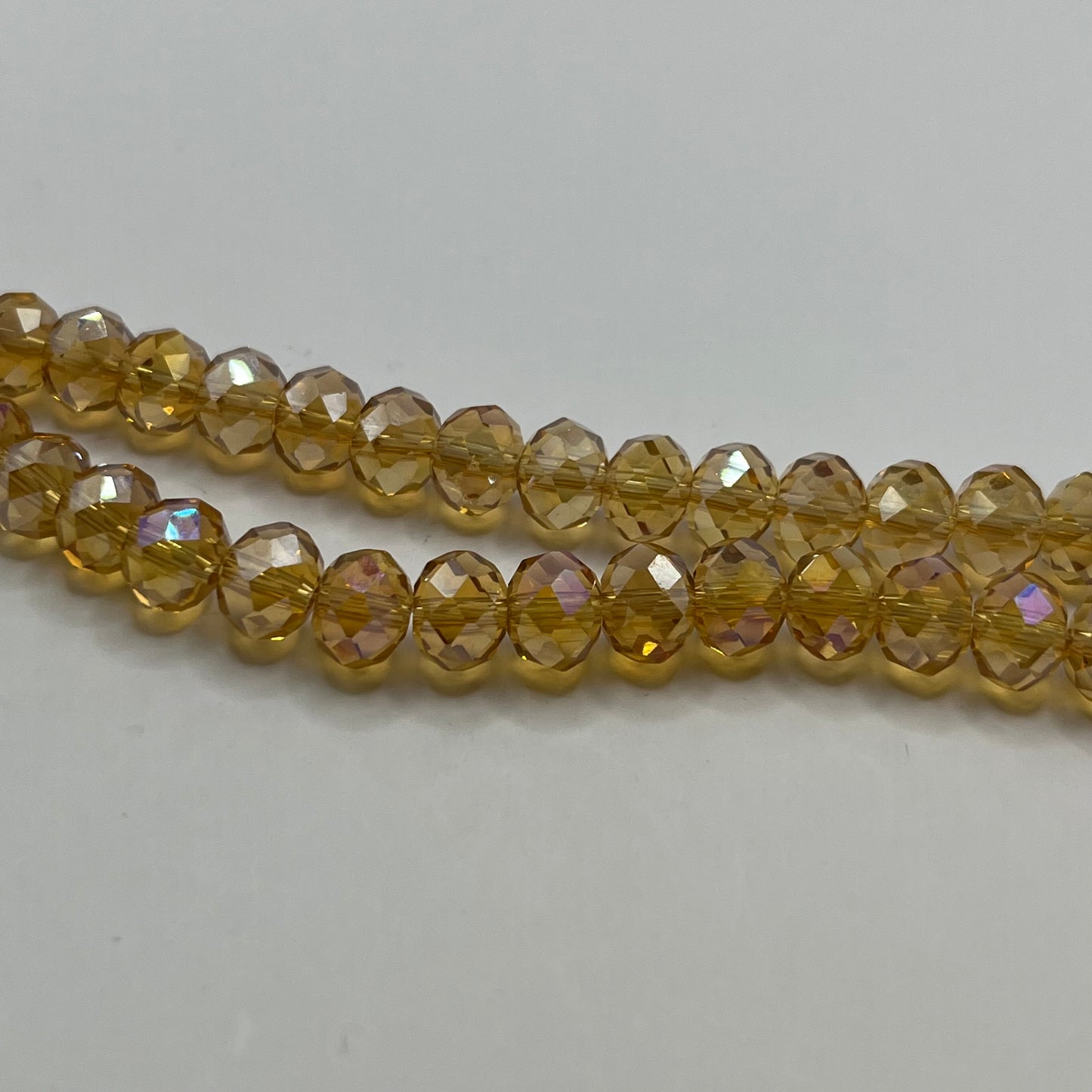 Chinese Crystal 8x6MM Faceted Rondelle Strand - Light Colorado Topaz AB