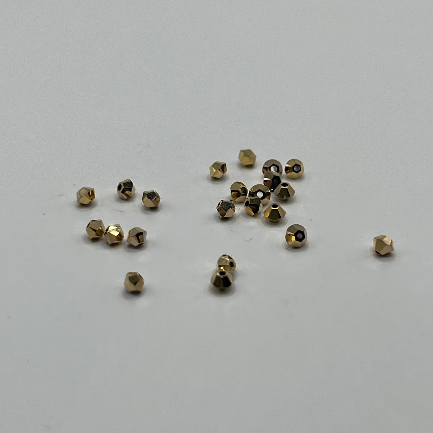 Swarovski 3MM Bicones - Crystal Aurum 2X (24pcs)