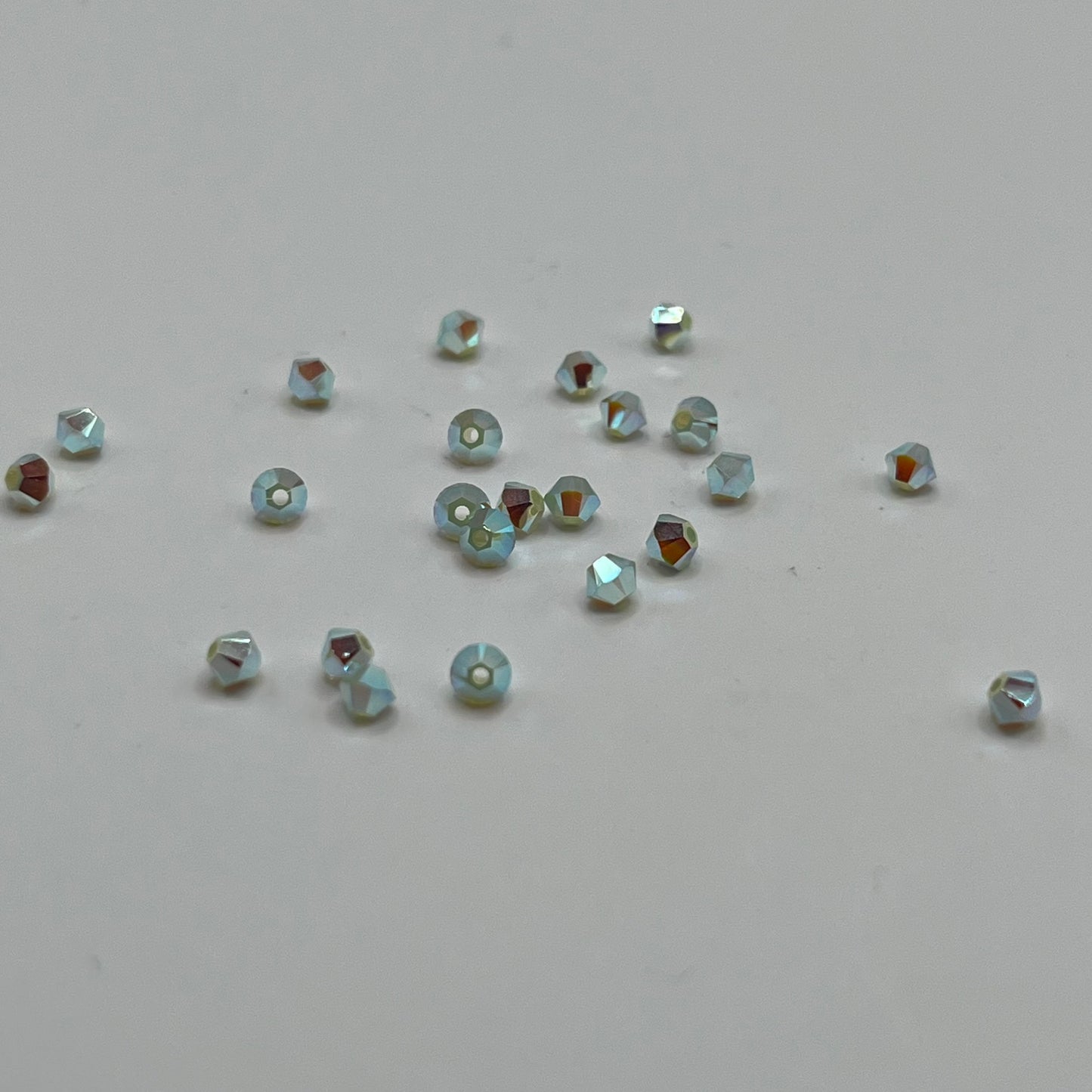 Swarovski 3MM Bicones - Chrysolite Opal AB2X (24pcs)